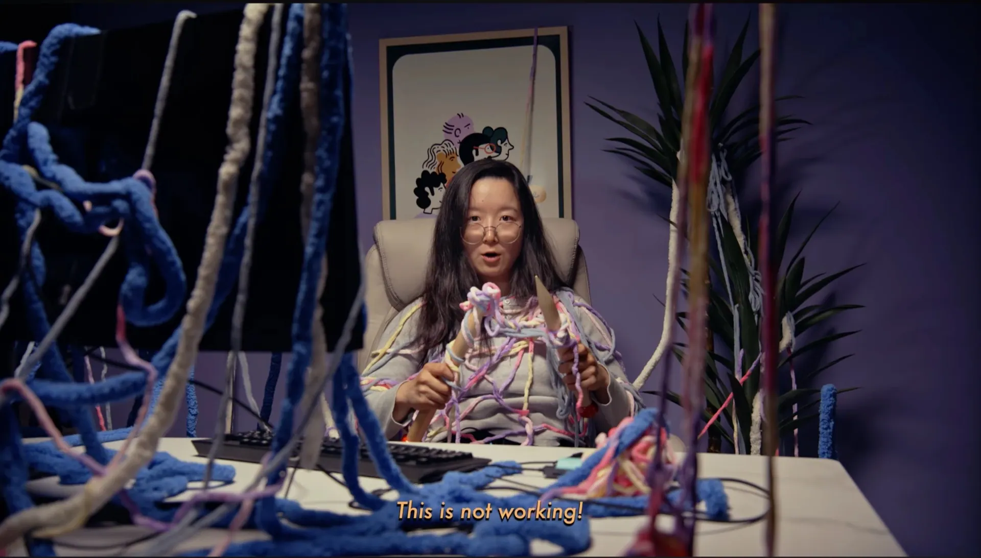 Founder tangled in yarn at her desk, from Accio Launchpad